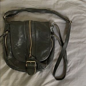 soft, black leather cross body bag with zippers
